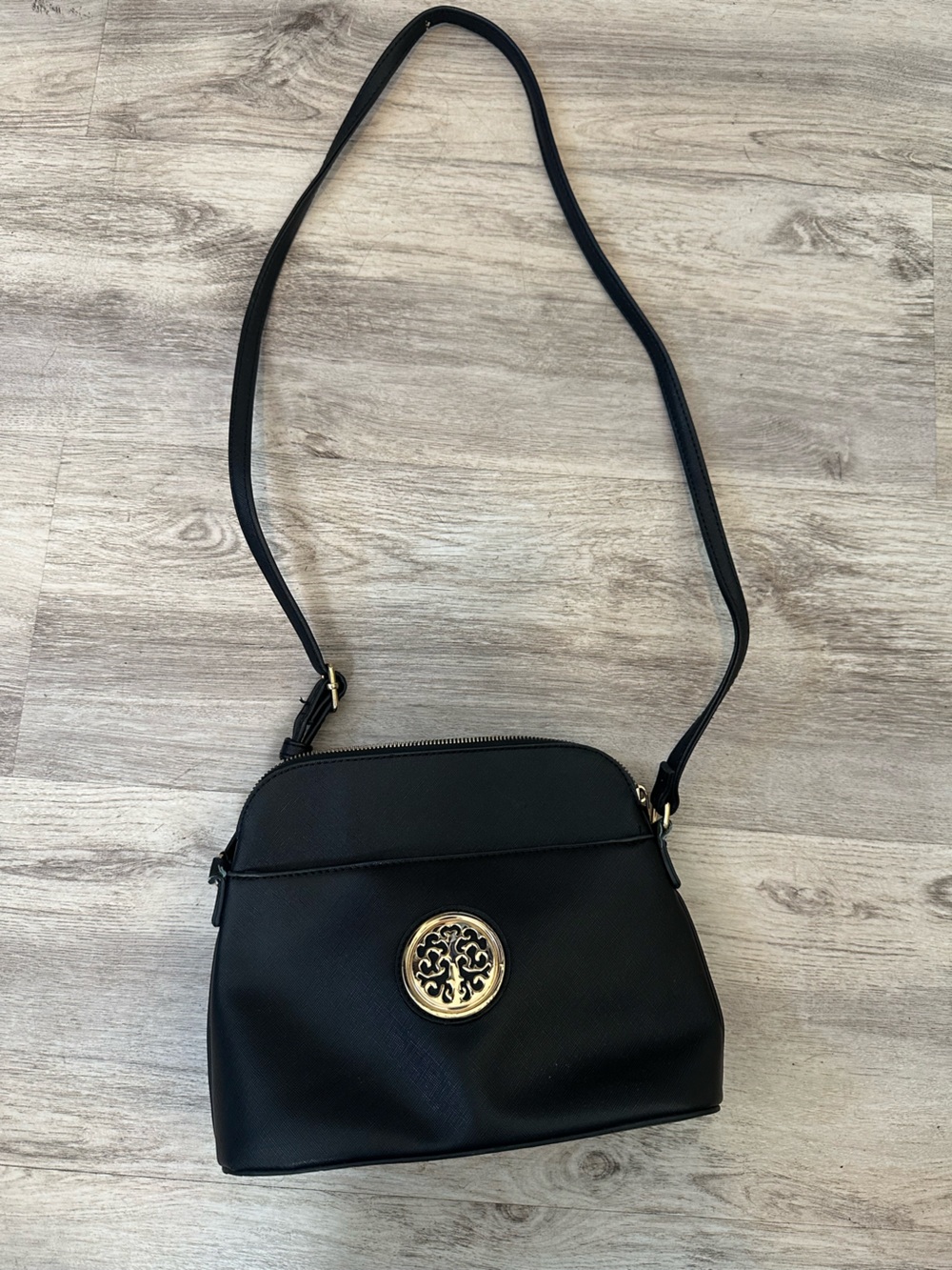 Black Crossbody Bag with Gold Medallion Accent